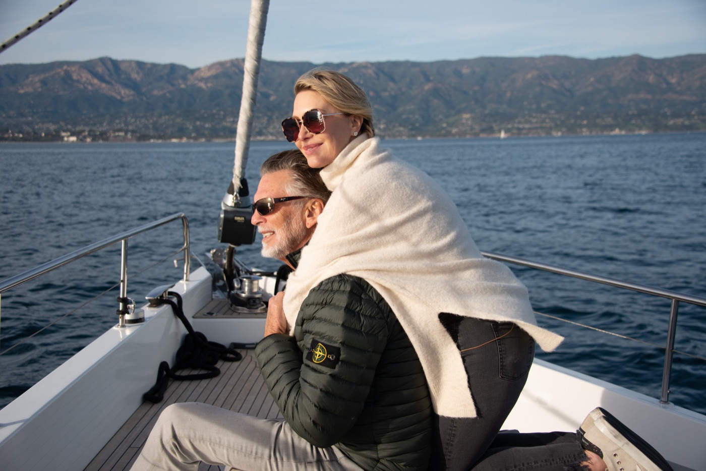 A couple aboard a yacht off the Santa Barbara coast at golden hour